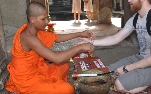 Buddhist Monk Bracelet Meaning- An Act of Blessing | Why Do Monks Give Bracelets?